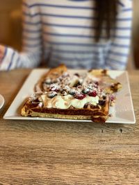 Midsection of pizza on table