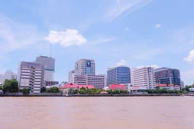 Buildings in city against sky