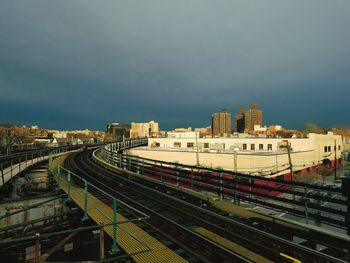 High angle view of train in city against sky