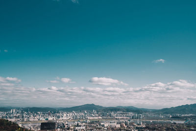 Buildings in city against sky