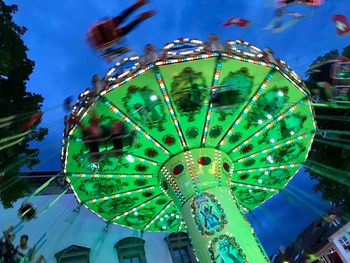 Low angle view of ferris wheel against sky