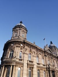 Low angle view of building against blue sky