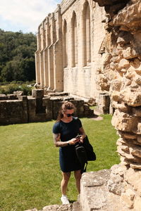 Side view of woman sitting on steps