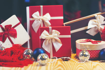 Close-up of christmas presents against black background