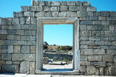 Old greek ruins against clear sky