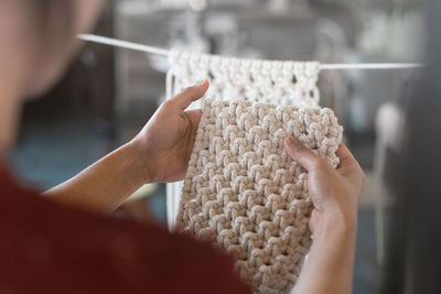 Close-up of woman holding fabric