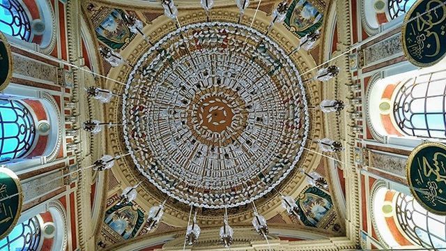 indoors, low angle view, architecture, place of worship, ornate, art and craft, religion, built structure, ceiling, design, church, spirituality, creativity, cathedral, art, pattern, famous place, architectural feature