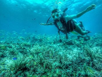 Person scuba diving in sea