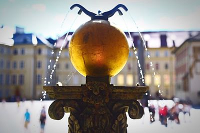 Close-up of lamp post against sky