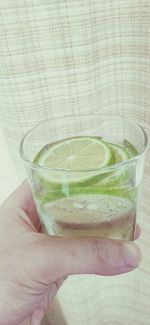 Cropped hand of woman holding drink