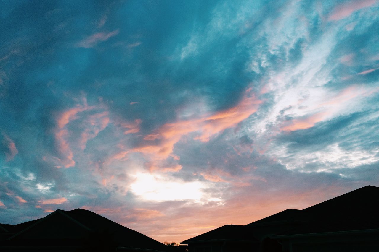 building exterior, sky, architecture, built structure, sunset, cloud - sky, silhouette, house, cloud, beauty in nature, scenics, residential structure, cloudy, low angle view, nature, residential building, dramatic sky, blue, outdoors, orange color