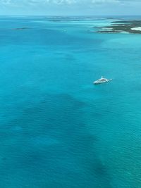 High angle view of ship sailing in sea