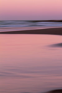 Scenic view of sea against sky at sunset