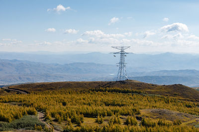 High voltage electric transmission, high voltage pylon in the mountains