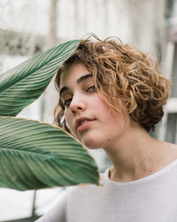 Portrait of woman by plants