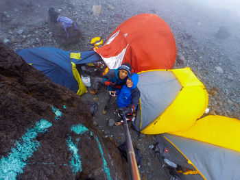 High angle view of people holding umbrella