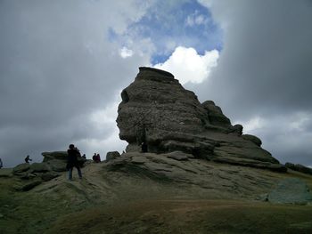 Scenic view of mountains against cloudy sky