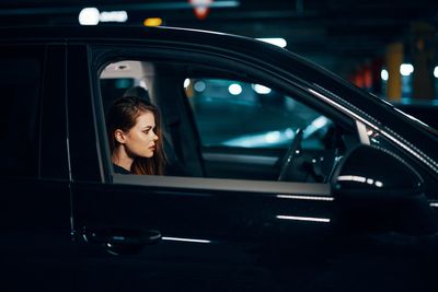 Side view of woman in car