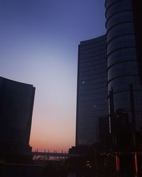 Low angle view of buildings at sunset