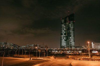 European central bank illuminated against sky at night 