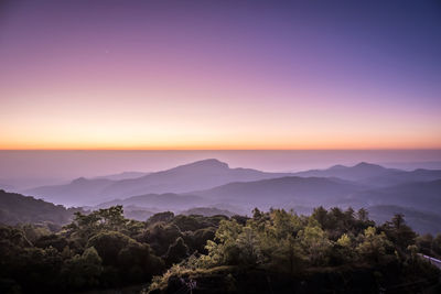 Scenic view of mountains against sky at sunset