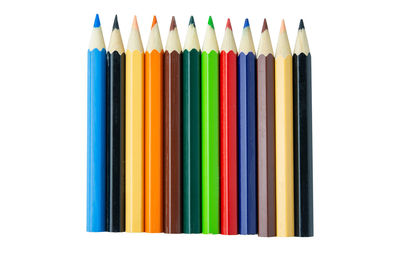 Close-up of colored pencils against white background