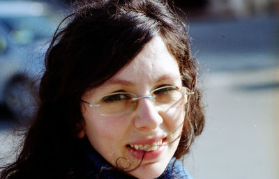 Close-up portrait of a smiling young woman