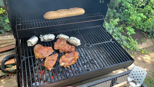 High angle view of meat on barbecue grill