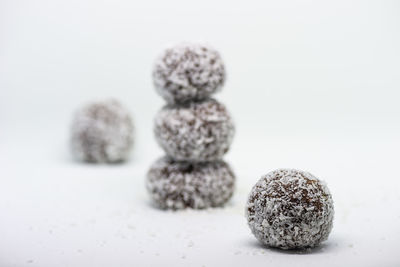 Close-up of christmas decorations on white background