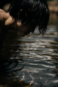 Reflection of man in swimming pool