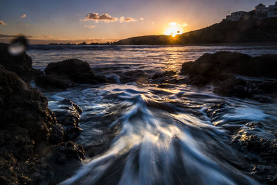 Scenic view of sea against sky during sunset