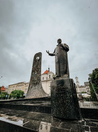 Low angle view of statue against sky