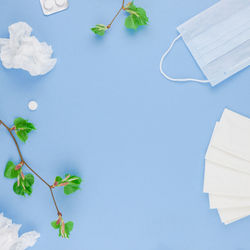 High angle view of book on table against blue background