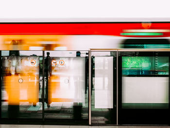 View of a fast moving train passing the security gates