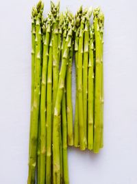 High angle view of vegetables on table against white background