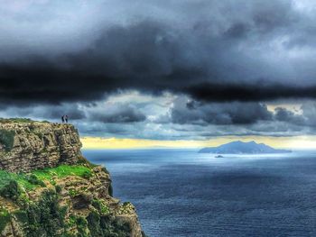 Scenic view of sea against cloudy sky