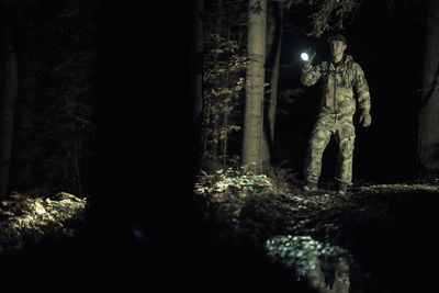 Man standing in forest