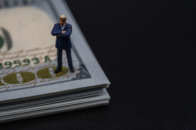 High angle view of man standing against black background