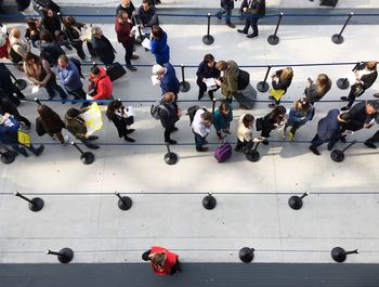 High angle view of people standing at airport