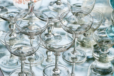 Close-up of wine glasses on table