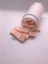 Close-up of pills on white background