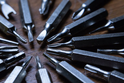 Close-up of drill bits on table