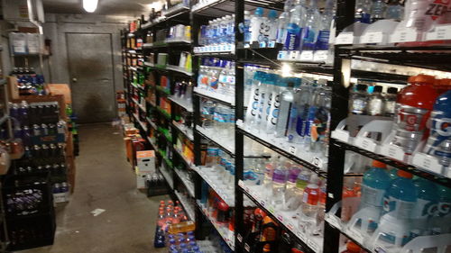 Panoramic shot of bottles in store