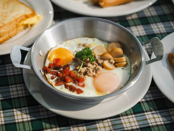 High angle view of food in bowl on table
egg pan