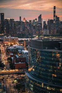 High angle view of illuminated buildings against sky during sunset