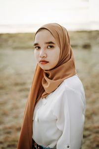 Portrait of beautiful woman standing outdoors