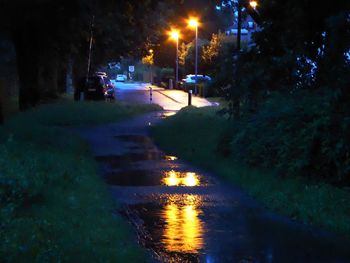 Illuminated road at night