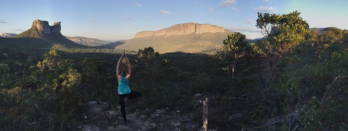 Rear view of woman doing yoga at chapada diamantina national park