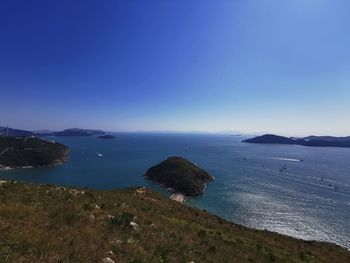 Scenic view of sea against blue sky