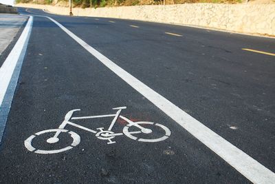 High angle view of bicycle sign on road